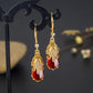 Boucles d'oreilles Eléphants avec pierre en agate rouge, bijou en acier inoxydable doré