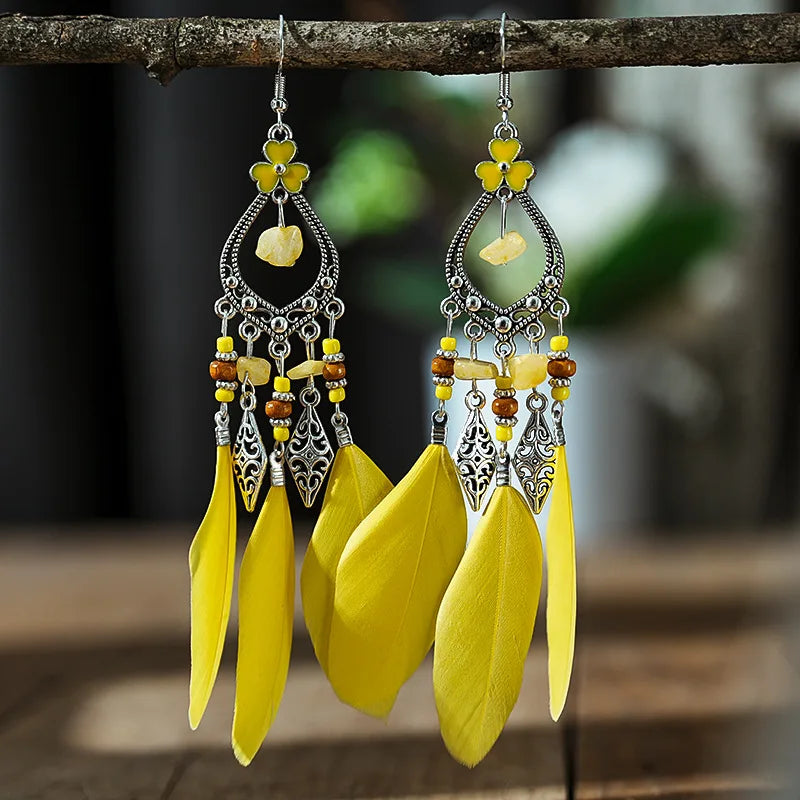 Boucles d'oreilles ethniques à perles et à plumes jaunes