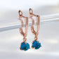 Boucles d'oreilles avec zircons ronds bleu clair, bijou en plaqué or rose