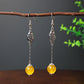 Boucles d'oreilles pendantes Perles Oeil de chat jaunes, bijou en acier inoxydable