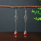 Boucles d'oreilles pendantes Perles Oeil de chat rouges, bijou en acier inoxydable