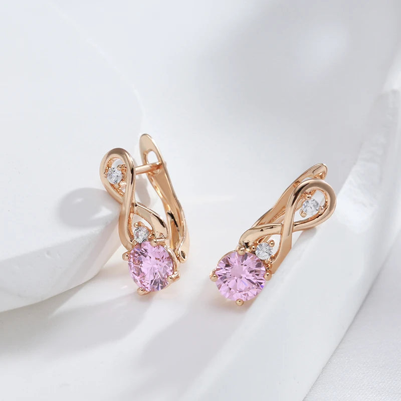 Boucles d'oreilles Symbole de l'infini et zircons roses, bijou en plaqué or rose