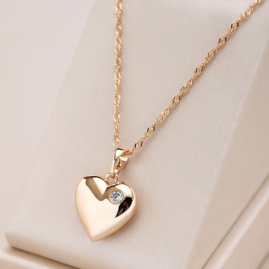 collier avec chaîne torsadée et pendentif coeur