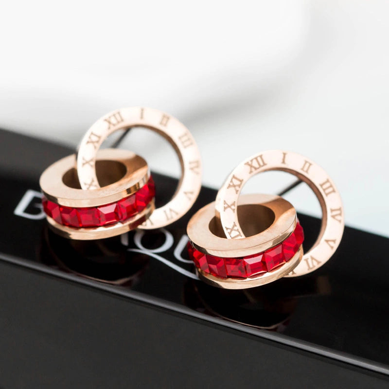 boucles d'oreilles avec zircons rouges et chiffres romains