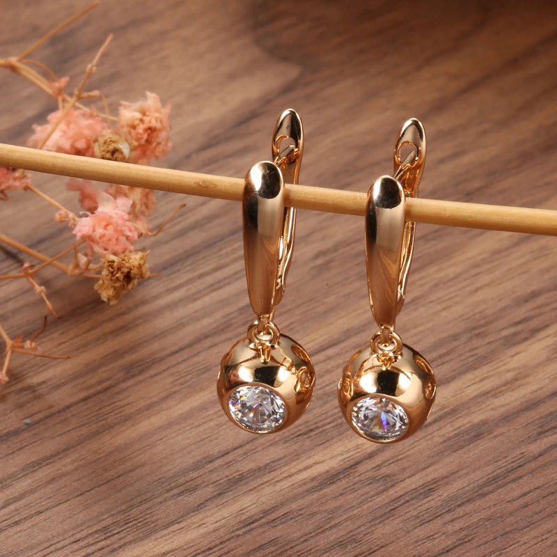 boucles d'oreilles boules avec zircons blancs