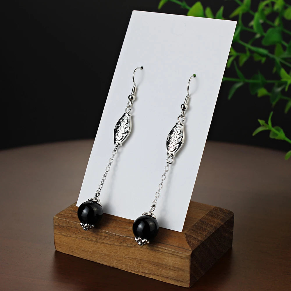 Boucles d'oreilles pendantes Perles "oeil de chat" noires, bijou en acier inoxydable