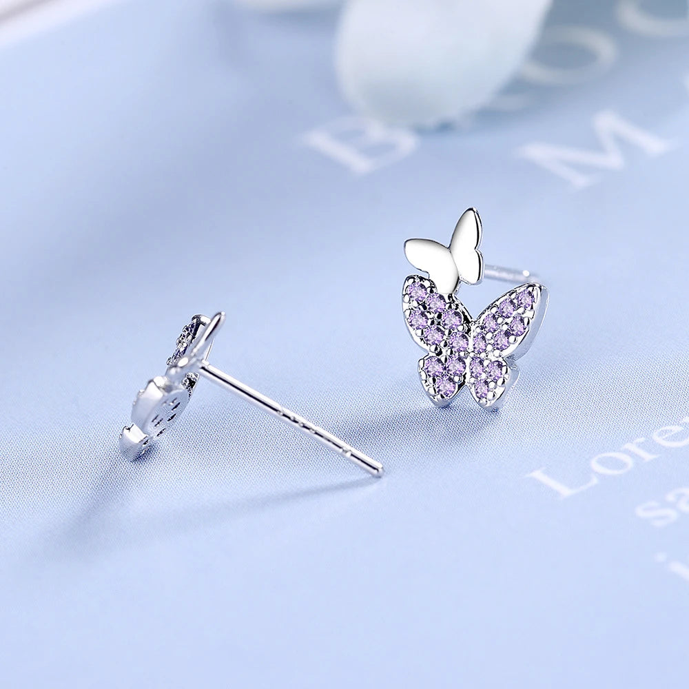 boucles d'oreilles papillons avec zircons mauves